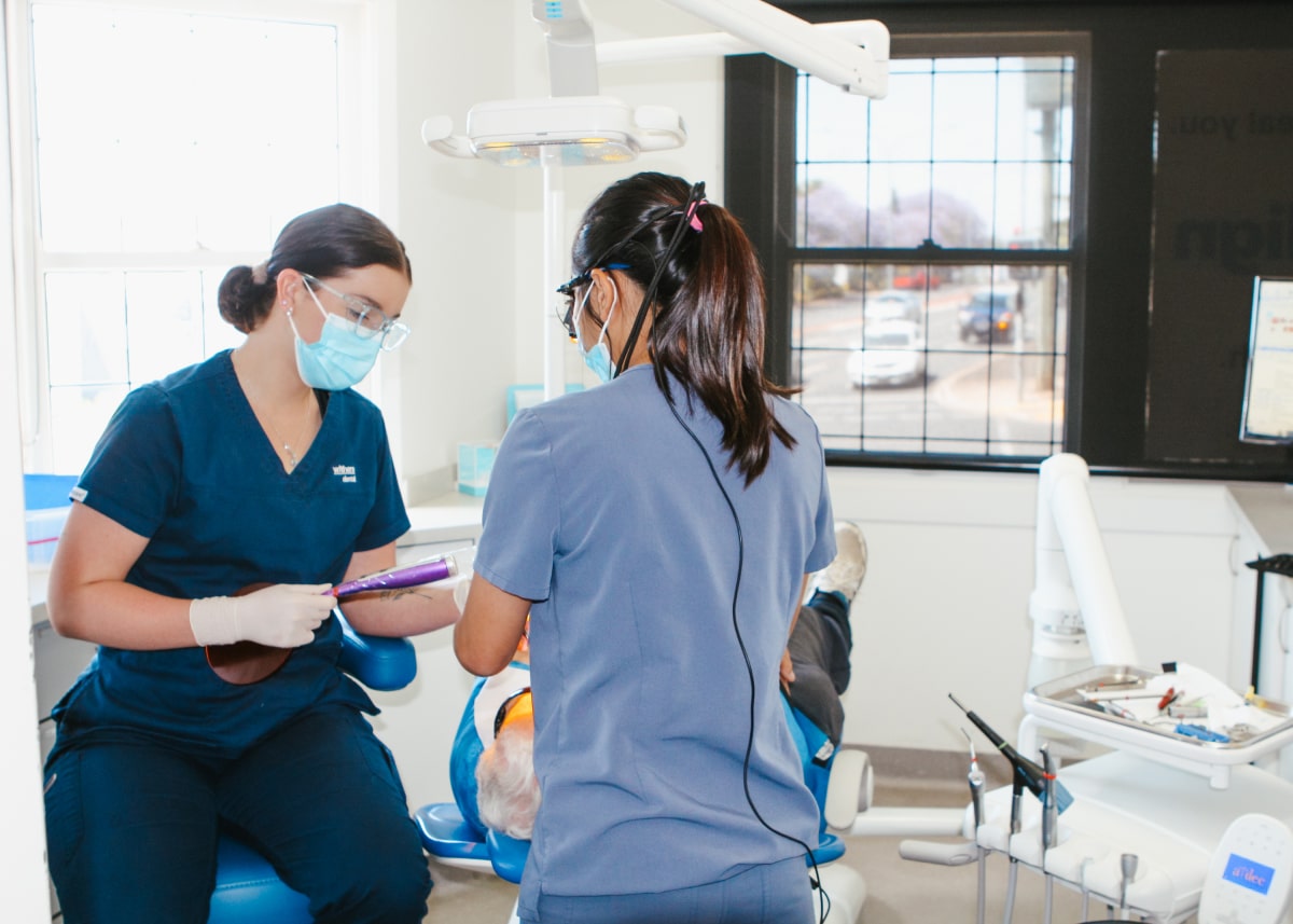 Two female dentists working together